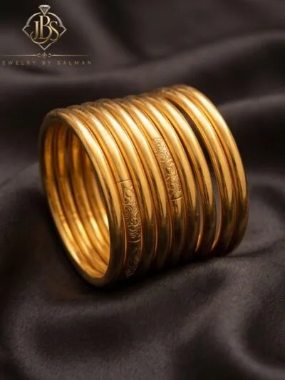 Gold-tone calligraphy-style bangles set of ten
