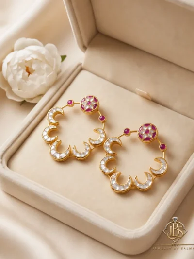 Pair of designer Kundan baliyan with zircon work displayed in a cream jewellery box