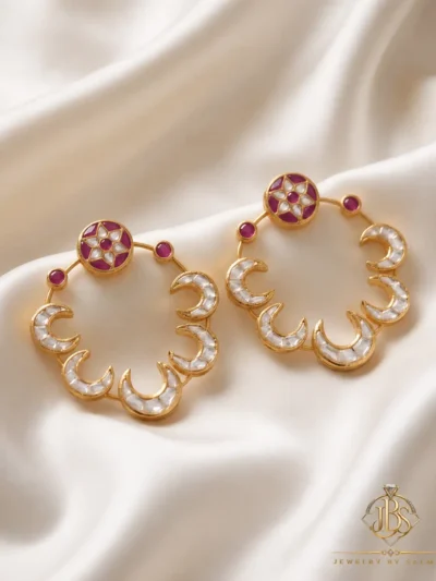 Pair of designer Kundan baliyan with crescent detailing, magenta accents and zircon work on cream satin