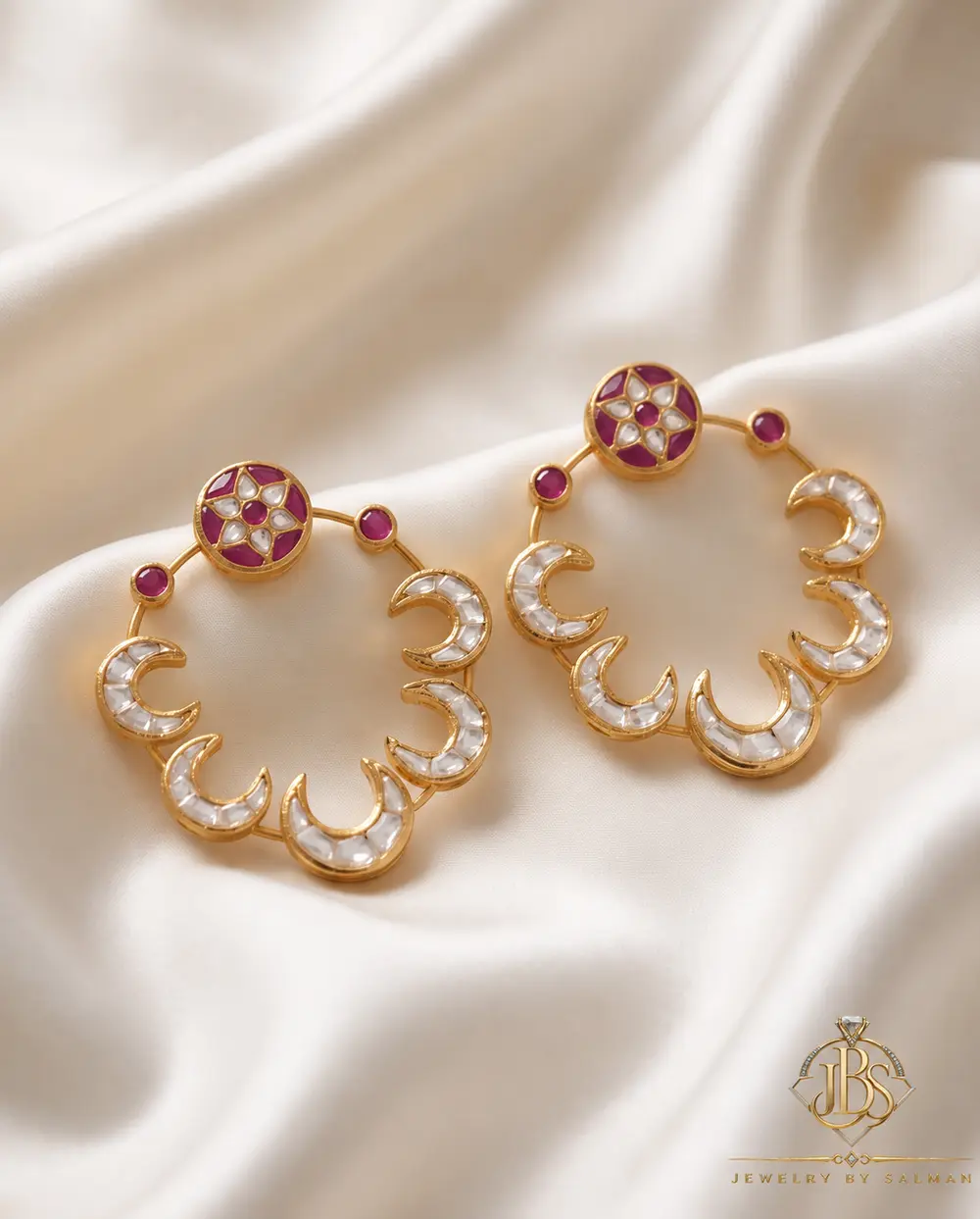 Designer Kundan Baliyan with Zircon Work - Pair Pair of designer Kundan baliyan with crescent detailing, magenta accents and zircon work on cream satin